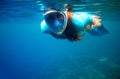 Woman swim in blue sea. Girl snorkeling in full-face mask. Snorkel closeup underwater photo. Snorkeling mask undersea Royalty Free Stock Photo