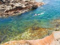 Woman swimming in crystal clear water Royalty Free Stock Photo