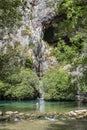 Woman swimming in natural pool at Cueva del Gato Spain