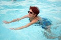 Woman swimming in the pool