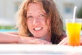 Woman in swimming pool with cocktail Royalty Free Stock Photo