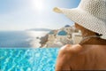 Woman at the swimming pool on the island of Santorini in Greece Royalty Free Stock Photo