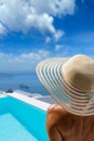 Woman at the swimming pool on the island of Santorini in Greece Royalty Free Stock Photo