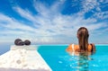 Woman at the swimming pool on the island of Santorini in Greece Royalty Free Stock Photo