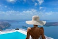 Woman at the swimming pool on the island of Santorini in Greece Royalty Free Stock Photo