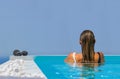 Woman at the swimming pool on the island of Santorini in Greece Royalty Free Stock Photo