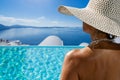 Woman at the swimming pool on the island of Santorini in Greece Royalty Free Stock Photo