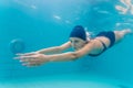 Woman swimming underwater in pool Royalty Free Stock Photo