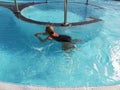 Woman swimming in the vortex pool