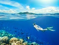 Woman swims around a coral reef Royalty Free Stock Photo