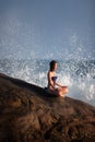 Woman in swimsui meditates Royalty Free Stock Photo