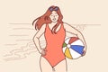 Woman in swimsuit with ball for beach volleyball stands on seashore enjoying summer vacation