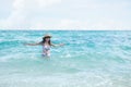 Woman with swimsuit swim in the sea Joyfully, happiness