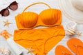 Woman swimwear and beach accessories flat lay top view on colored background Summer travel concept. bikini swimsuit Royalty Free Stock Photo