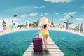 Woman in swimwear travelling to the world monuments Royalty Free Stock Photo