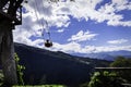 Woman on the swing of the end of the world Columpio del fin del mundo in BaÃÂ±os, Ambato. Royalty Free Stock Photo