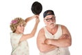 Woman swinging frying pan at husband Royalty Free Stock Photo