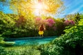 Woman swinging on the river Royalty Free Stock Photo