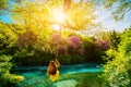 Woman swinging on the river Royalty Free Stock Photo