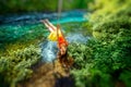 Woman swinging on the river Royalty Free Stock Photo