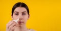 Woman with Swollen Cleaning Her Blocked Nose with a Blue Rubber Nose Pump