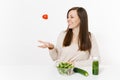 Woman at table with green detox smoothies, fresh salad in glass bowl, tomato, cucumber isolated on white background Royalty Free Stock Photo