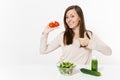 Woman at table with green detox smoothies, fresh salad in glass bowl, tomato, cucumber isolated on white background Royalty Free Stock Photo