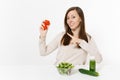 Woman at table with green detox smoothies, fresh salad in glass bowl, tomato, cucumber isolated on white background Royalty Free Stock Photo