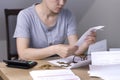 A woman at the table looks at receipts and bills Royalty Free Stock Photo