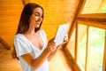 Woman with tablet in the wooden house Royalty Free Stock Photo