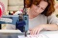 Woman tailor, fabric sewing, female sewing