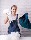 Woman tailor stuffing a pillow in her studio Royalty Free Stock Photo