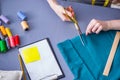 Woman tailor working on a clothing sewing stitching measuring fa Royalty Free Stock Photo