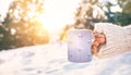 Woman take in hand cup of hot drink. Mug close up shoot Royalty Free Stock Photo