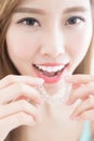 Woman take invisible braces Royalty Free Stock Photo