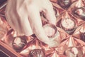 Woman takes a chocolate from the box Royalty Free Stock Photo