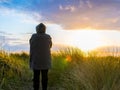 Woman Takes In Fleeting Sunset Moment