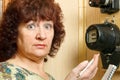 A woman records the testimony of an apartment electricity meter Royalty Free Stock Photo
