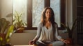 Woman takes a mindful meditation break in her home office bathed in natural light