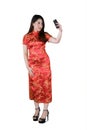 Woman takes photo with cheongsam dress