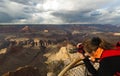 Woman takes photograph of Grand Canyon Royalty Free Stock Photo