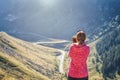 Woman takes photos of Transfagarasan mountain road Royalty Free Stock Photo