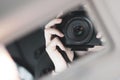 A woman takes a picture with a camera, female hands hold the camera close-up. Photographer. Royalty Free Stock Photo