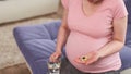 A woman takes vitamins during pregnancy