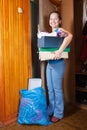 Woman taking away the garbage Royalty Free Stock Photo