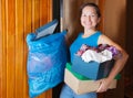 Woman taking away the garbage