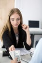 Woman taking batch of hundred dollar bills Royalty Free Stock Photo