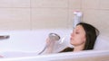 Woman is taking a bath. Relax after a bad day.