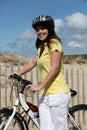 Woman taking a bike ride Royalty Free Stock Photo