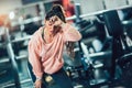 Woman taking a break after workout in gym Royalty Free Stock Photo